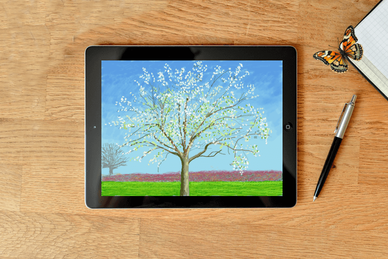 Tablette ouverte sur une page d'une aquarelle de David Hockney représentant un arbre dans un jardin normand